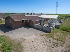 an aerial view of a brick house with a large patio at Holiday Home Nanette - 300m to the inlet by Interhome in Ringkøbing