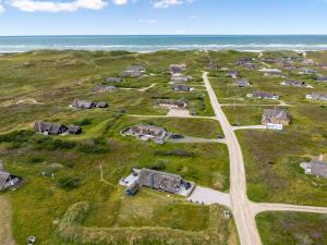 an aerial view of a group of houses on the beach at Holiday Home Hen - 400m from the sea by Interhome in Ringkøbing