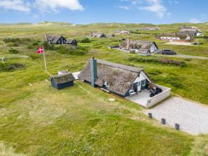 an overhead view of a small house in a field at Holiday Home Hen - 400m from the sea by Interhome in Ringkøbing