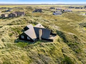 an aerial view of a house in a field at Holiday Home Eggert - from the sea by Interhome in Ringkøbing