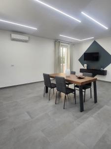 a dining room with a table and chairs at Holiday Home in Giardini Naxos