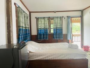 Katil atau katil-katil dalam bilik di Sipasert Guesthouse-Tadlo