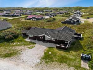 an aerial view of a home in a field at Holiday Home Thrugot - from the sea by Interhome in Bjerregård