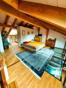 a large room with a bed and a pool at Onkel Toms Hütte in Glarus