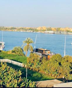 a view of a large body of water with a building at pradise house holday in Banī Ghālib
