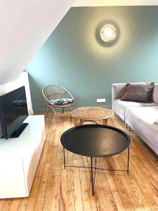 TV a/nebo společenská místnost v ubytování Appartement BZH