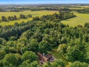 an aerial view of an old house in the forest at Holiday Home Fina - 15km from the sea by Interhome in Tim +26 photos