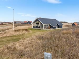 a house in the middle of a field at Holiday Home Galmand - 300m from the sea by Interhome in Lemvig