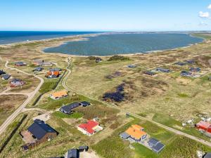 an aerial view of a group of houses next to the ocean at Holiday Home Luiza - 300m from the sea by Interhome in Lemvig
