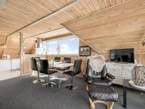a dining room with a table and chairs at Holiday Home Agga - 200m from the sea by Interhome in Harboør
