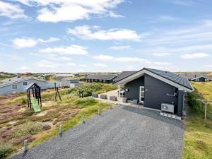 a home with a playground and a house at Holiday Home Ennie - from the sea by Interhome in Bjerregård +48 photos