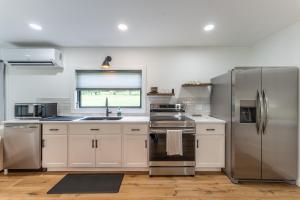 a kitchen with stainless steel appliances and a window at Ravenwood in Killbuck
