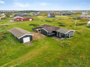 an overhead view of a house in a field at Holiday Home Viveka - 500m from the sea by Interhome in Harboør