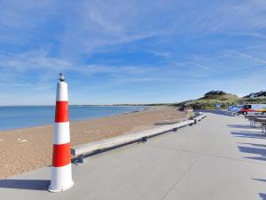 a orange and white cone sitting on a beach at Holiday Home Usko - 250m from the sea by Interhome in Torsted