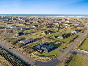 an aerial view of a suburb with houses and the ocean at Holiday Home Damaskin - 300m from the sea by Interhome in Harboør