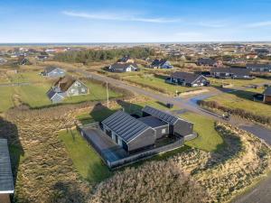 an overhead view of a house with a solar roof at Holiday Home Damaskin - 300m from the sea by Interhome in Harboør