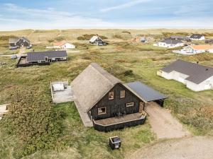 an overhead view of a barn in a field at Holiday Home Kristanna - 150m from the sea by Interhome in Harboør +35 photos