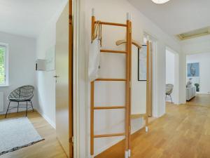 a room with a ladder and a room with a hallway at Holiday Home Flor - 900m from the sea by Interhome in Torsted
