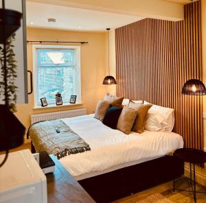 a bedroom with a large bed and a window at 8 Parker Street in Lancaster
