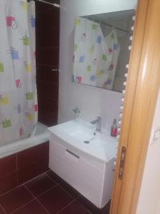 a bathroom with a sink and a mirror at Luxury lac 2 mall in Tunis