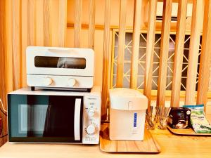 Nhà bếp/bếp nhỏ tại のどかな風景と綺麗な星空の宿キノイロ ミニマル"Kinoiro Minimal" +17 ảnh