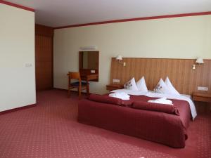 Vuode tai vuoteita majoituspaikassa Hotel Tigra