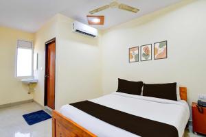 a bedroom with a large bed in a room at Collection O Chengicherla Hyderabad in Hyderabad