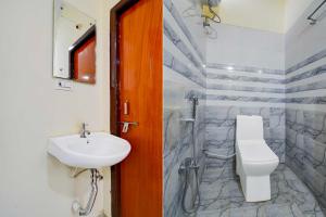 a bathroom with a sink and a toilet and a shower at Collection O Chengicherla Hyderabad in Hyderabad