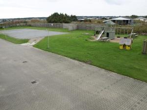 a park with a playground with at Apartment Lenya - 150m from the sea by Interhome in Løkken