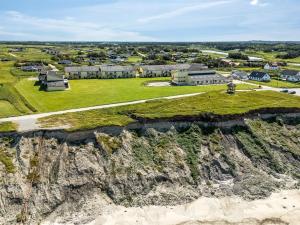 an aerial view of a small town on a cliff at Apartment Helke - 150m from the sea by Interhome in Løkken +21 photos