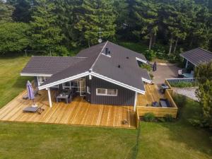 an aerial view of a house with a deck at Holiday Home Aniki - 1-4km from the sea by Interhome in Løkken