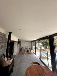 a living room with a fireplace and a table at Casa Arriettas in Tijarafe