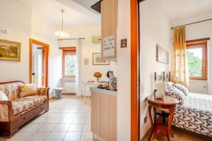 a living room with a couch and a table at La Casa di Ale 1 - Castelli Romani in Marino +15 photos