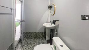 a white bathroom with a sink and a toilet at Memory เมมโมรี่ ภูทับเบิก in Ban Maeo Thap Boek +49 photos