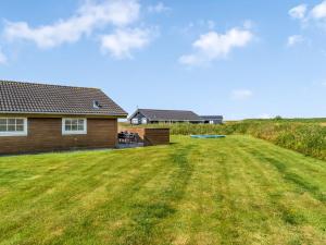 a large yard in front of a house at Holiday Home Anya - 650m from the sea by Interhome in Løkken