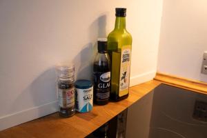 two bottles of wine sitting on top of a counter at Central Spacious Studio Apt I 5 Minutes to Metro in Copenhagen