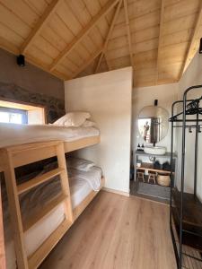 a bedroom with bunk beds and a desk at Casa Arriettas in Tijarafe +26 photos