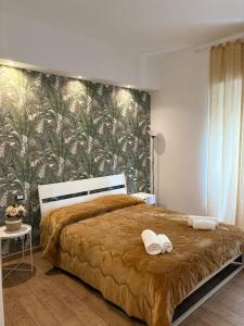 Ένα ή περισσότερα κρεβάτια σε δωμάτιο στο MVM Apartment