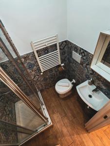 a bathroom with a toilet and a sink at MVM Apartment in Rome