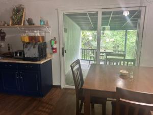 a kitchen with a table with a blender on it at The Brookside Motel Keystone Near Mt Rushmore in Keystone