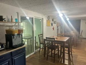 a kitchen with a table and chairs and a dining room at The Brookside Motel Keystone Near Mt Rushmore in Keystone +19 photos