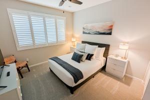 a bedroom with a bed and a window at Blue Agave Dreams in Marana +46 photos