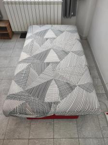 a bed sitting on the floor in a room at Appartamento Gigio - Incisa Valdarno in Vivajo