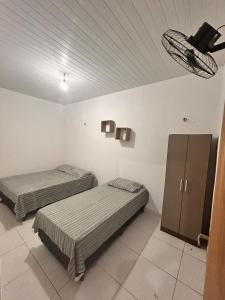 Postel nebo postele na pokoji v ubytování Casa Pé na Areia