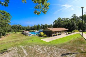 an aerial view of a house with a swimming pool at Cheerful Hot Springs Village Condo in Hot Springs