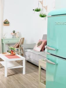 a living room with a couch and a table at Abades South Beach Domi,air,wifi ,parking in Abades