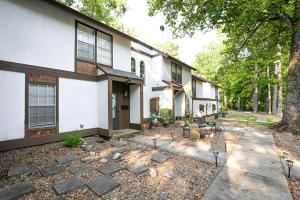 a house with a pathway leading to it at Cheerful Hot Springs Village Condo in Hot Springs