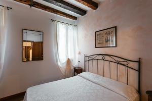 Postel nebo postele na pokoji v ubytování Locanda Art Deco + 37 fotografií
