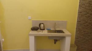 a kitchen counter with a sink in a room at Villa 307A in Matara