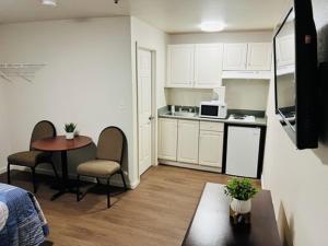 a small kitchen with a table and chairs in a room at Stay Lodge of Decatur in Decatur